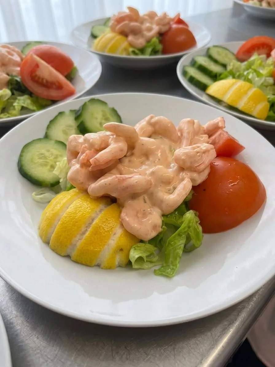 Prawn cocktail with lemon, cucumber and tomato