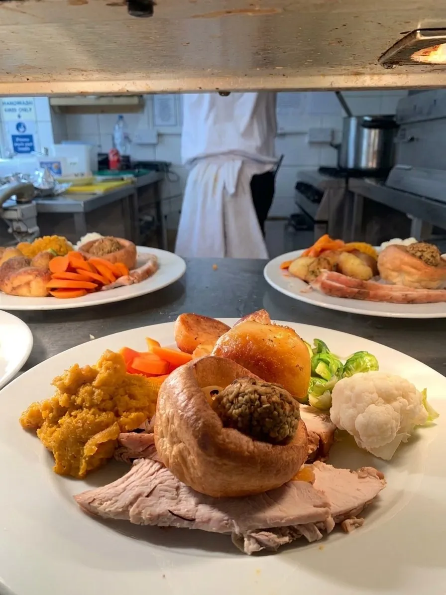 Sunday roasts being plated up at the kitchen pass